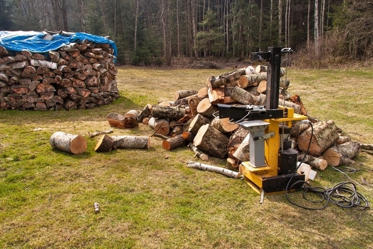 A shed filled with firewood, all thanks to electric log splitters