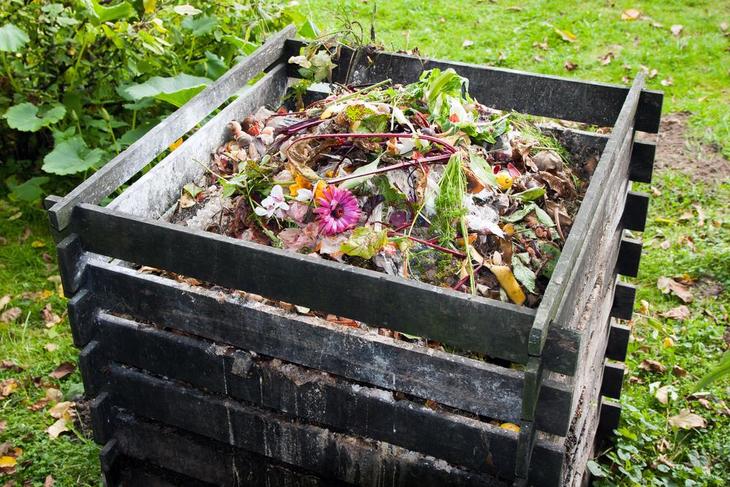A traditional compost bin without lid