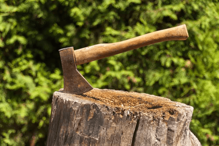 An axe is used to cut woods into small pieces.