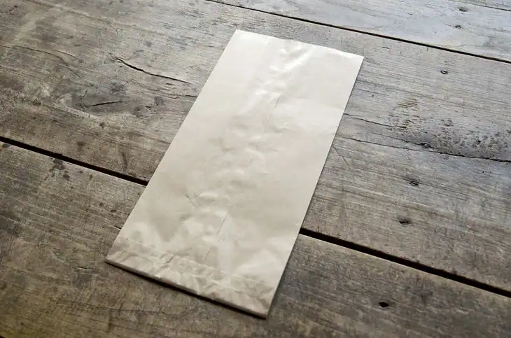 Paper bags absorb the moisture of un-husk tomatillos when they are stored in the refrigerator