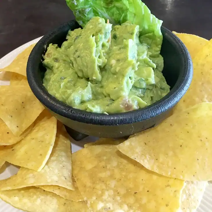 Tomatillos improve the flavor of salsas such as guacamole
