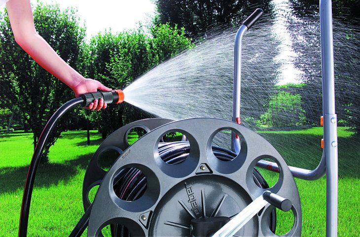 watering the yard with a hose reels