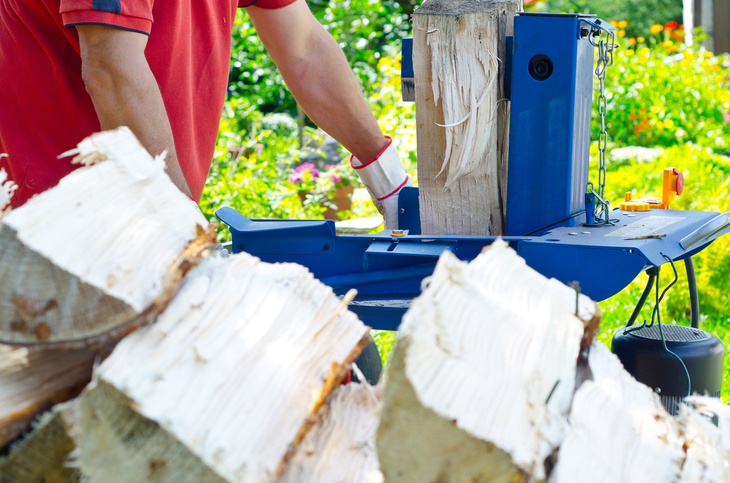 In need of instant firewood-Use electric log splitter to split the wood into pieces