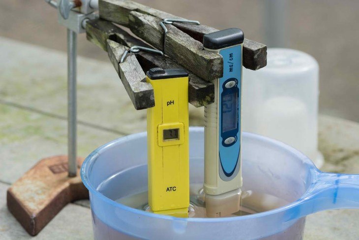 pH level is measured using a pH meter to ensure the right acidity or alkalinity levels